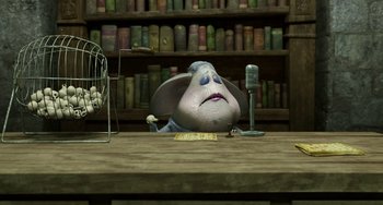 Movie still from “Hotel Transylvania” (2012), directed by Genndy Tartakovsky – An animated character sitting in front of a microphone on top of a desk; Medium shot, Low angle
