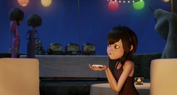 Movie still from “Hotel Transylvania” (2012), directed by Genndy Tartakovsky – A girl holding a plate in her hands; Medium shot, Over the shoulder angle
