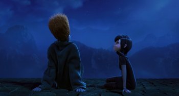 Movie still from “Hotel Transylvania” (2012), directed by Genndy Tartakovsky – Two people sitting on the ground looking at each other; Medium shot, High angle