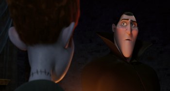Movie still from “Hotel Transylvania” (2012), directed by Genndy Tartakovsky – Two animated characters looking at each other in the dark; Close Up shot, Over the shoulder angle