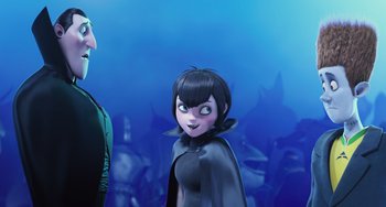 Movie still from “Hotel Transylvania” (2012), directed by Genndy Tartakovsky – A woman in a black dress and a man in a green suit; Medium shot, Over the shoulder angle