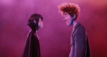 Movie still from “Hotel Transylvania” (2012), directed by Genndy Tartakovsky – A couple of people standing next to each other on a purple background; Medium shot, Over the shoulder angle