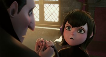 Movie still from “Hotel Transylvania” (2012), directed by Genndy Tartakovsky – A woman is holding a pen in her hand while a man looks at her; Close Up shot, Over the shoulder angle