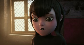 Movie still from “Hotel Transylvania” (2012), directed by Genndy Tartakovsky – An animated girl with a black shirt and black hair; Close Up shot, Over the shoulder angle