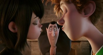 Movie still from “Hotel Transylvania” (2012), directed by Genndy Tartakovsky – Two women and a man are looking at each other's face; Close Up shot, Over the shoulder angle