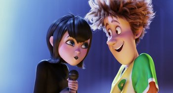 Movie still from “Hotel Transylvania” (2012), directed by Genndy Tartakovsky – A woman and a man are standing next to each other; Medium shot, Over the shoulder angle