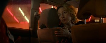 Movie still from “Ghostbusters: Afterlife” (2021), directed by Jason Reitman – A woman sitting in the back seat of a car; Close Up shot, Over the shoulder angle