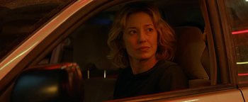 Movie still from “Ghostbusters: Afterlife” (2021), directed by Jason Reitman – A woman sitting in the passenger seat of a car looking out of the window; Close Up shot, Over the shoulder angle