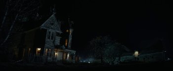Movie still from “Ghostbusters: Afterlife” (2021), directed by Jason Reitman – An old house is lit up at night time; Extreme Wide shot, Low angle