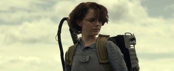 Movie still from “Ghostbusters: Afterlife” (2021), directed by Jason Reitman – A person with a backpack and glasses on; Close Up shot, Low angle