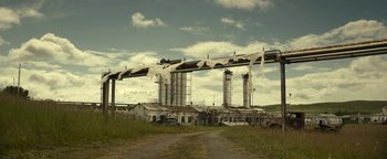 Movie still from “Ghostbusters: Afterlife” (2021), directed by Jason Reitman – An old factory with a large amount of white stuff coming out of it; Extreme Wide shot, Low angle