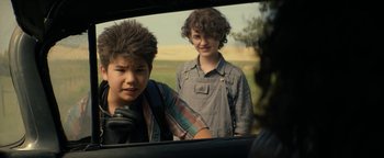 Movie still from “Ghostbusters: Afterlife” (2021), directed by Jason Reitman – Two young boys are looking in a mirror; Close Up shot, Over the shoulder angle