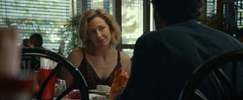 Movie still from “Ghostbusters: Afterlife” (2021), directed by Jason Reitman – A woman sitting at a table with a man in front of a window; Close Up shot, Over the shoulder angle