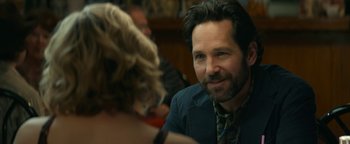 Movie still from “Ghostbusters: Afterlife” (2021), directed by Jason Reitman – A man and a woman sitting at a table together; Close Up shot, Over the shoulder angle