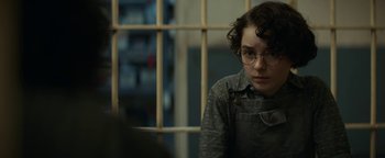 Movie still from “Ghostbusters: Afterlife” (2021), directed by Jason Reitman – A person sitting in front of a window; Close Up shot, Over the shoulder angle