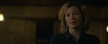 Movie still from “Ghostbusters: Afterlife” (2021), directed by Jason Reitman – A person wearing a black shirt; Close Up shot, Over the shoulder angle