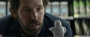 Movie still from “Ghostbusters: Afterlife” (2021), directed by Jason Reitman – A person looking at a lego figure; Close Up shot, Over the shoulder angle