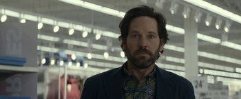 Movie still from “Ghostbusters: Afterlife” (2021), directed by Jason Reitman – A person wearing a suit and tie; Close Up shot, Over the shoulder angle