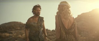 Movie still from “Ghostbusters: Afterlife” (2021), directed by Jason Reitman – A man and a woman are standing in the desert; Medium shot, Over the shoulder angle