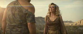 Movie still from “Ghostbusters: Afterlife” (2021), directed by Jason Reitman – A man and a woman standing next to each other in the desert; Medium shot, Over the shoulder angle