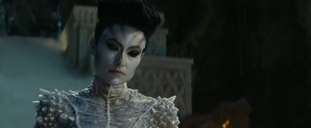 Movie still from “Ghostbusters: Afterlife” (2021), directed by Jason Reitman – A woman dressed as a skeleton in a white costume; Close Up shot, Low angle