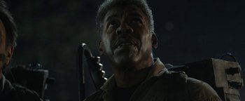 Movie still from “Ghostbusters: Afterlife” (2021), directed by Jason Reitman – An older man with a beard is looking up; Close Up shot, Low angle