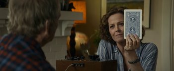 Movie still from “Ghostbusters: Afterlife” (2021), directed by Jason Reitman – A woman sitting in front of an old record player; Close Up shot, Over the shoulder angle