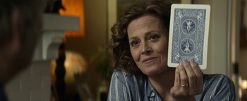 Movie still from “Ghostbusters: Afterlife” (2021), directed by Jason Reitman – A person holding a book in their hand; Close Up shot, Over the shoulder angle