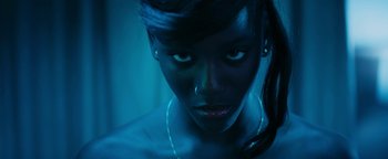 Movie still from “Girlhood” (2014), directed by Céline Sciamma – A person wearing a necklace; Extreme Close Up shot, Overhead angle