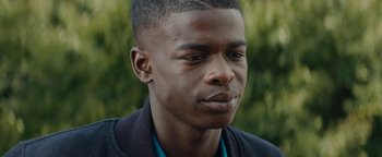 Movie still from “Girlhood” (2014), directed by Céline Sciamma – A person wearing a jacket; Close Up shot, Low angle