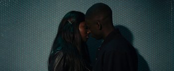 Movie still from “Girlhood” (2014), directed by Céline Sciamma – A man and a woman are touching heads in the dark; Close Up shot, High angle