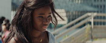 Movie still from “Girlhood” (2014), directed by Céline Sciamma – A person wearing a white shirt; Close Up shot, High angle