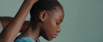 Movie still from “Girlhood” (2014), directed by Céline Sciamma – A person with their hair up; Close Up shot, Low angle