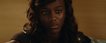 Movie still from “Girlhood” (2014), directed by Céline Sciamma – A person with a piercing on her nose; Close Up shot, High angle