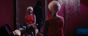 Movie still from “Girlhood” (2014), directed by Céline Sciamma – A woman sitting in front of a mirror in front of a mirror; Medium shot, Over the shoulder angle