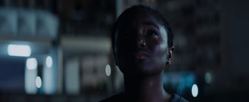 Movie still from “Girlhood” (2014), directed by Céline Sciamma – A person looking up at the sky; Close Up shot, Low angle