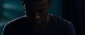 Movie still from “Girlhood” (2014), directed by Céline Sciamma – A person with his eyes closed; Close Up shot, Low angle
