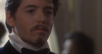 Movie still from “Glory” (1989), directed by Edward Zwick – A person wearing a suit and tie; Close Up shot, Over the shoulder angle