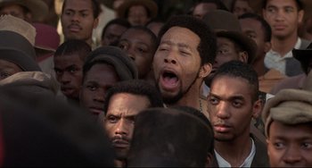 Movie still from “Glory” (1989), directed by Edward Zwick – A group of men standing next to each other; Close Up shot, High angle