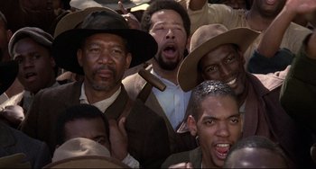Movie still from “Glory” (1989), directed by Edward Zwick – A group of men standing next to each other in hats; Close Up shot, Low angle