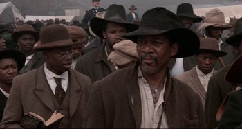 Movie still from “Glory” (1989), directed by Edward Zwick – A group of men wearing hats and suits; Close Up shot, Low angle