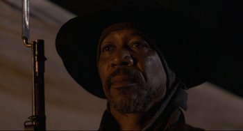 Movie still from “Glory” (1989), directed by Edward Zwick – A person wearing a hat; Close Up shot, Low angle
