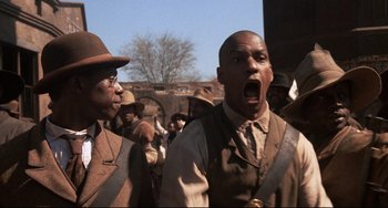 Movie still from “Glory” (1989), directed by Edward Zwick – A group of men standing next to each other; Close Up shot, Low angle