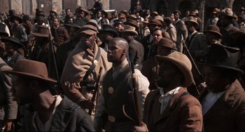 Movie still from “Glory” (1989), directed by Edward Zwick – A group of men in a crowd of people; Medium shot, High angle