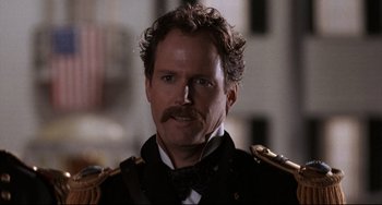 Movie still from “Glory” (1989), directed by Edward Zwick – A person with a mustache wearing a uniform; Close Up shot, Low angle