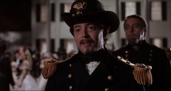 Movie still from “Glory” (1989), directed by Edward Zwick – A person wearing a uniform and a hat; Close Up shot, Low angle