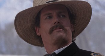 Movie still from “Glory” (1989), directed by Edward Zwick – A person wearing a straw hat; Close Up shot, Low angle