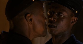 Movie still from “Glory” (1989), directed by Edward Zwick – Two men face each other in a close up picture; Close Up shot, Over the shoulder angle