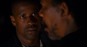 Movie still from “Glory” (1989), directed by Edward Zwick – A man with his face close to another man's face; Close Up shot, Over the shoulder angle