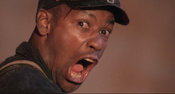 Movie still from “Glory” (1989), directed by Edward Zwick – A person with his mouth wide open; Close Up shot, Low angle